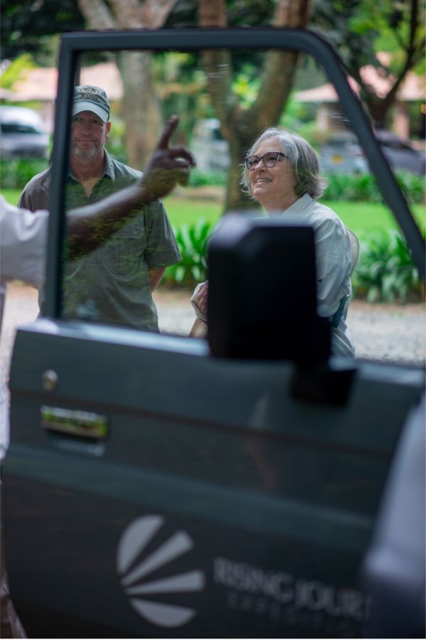 Rising Journey Expeditions guide with guests on safari in Tanzania