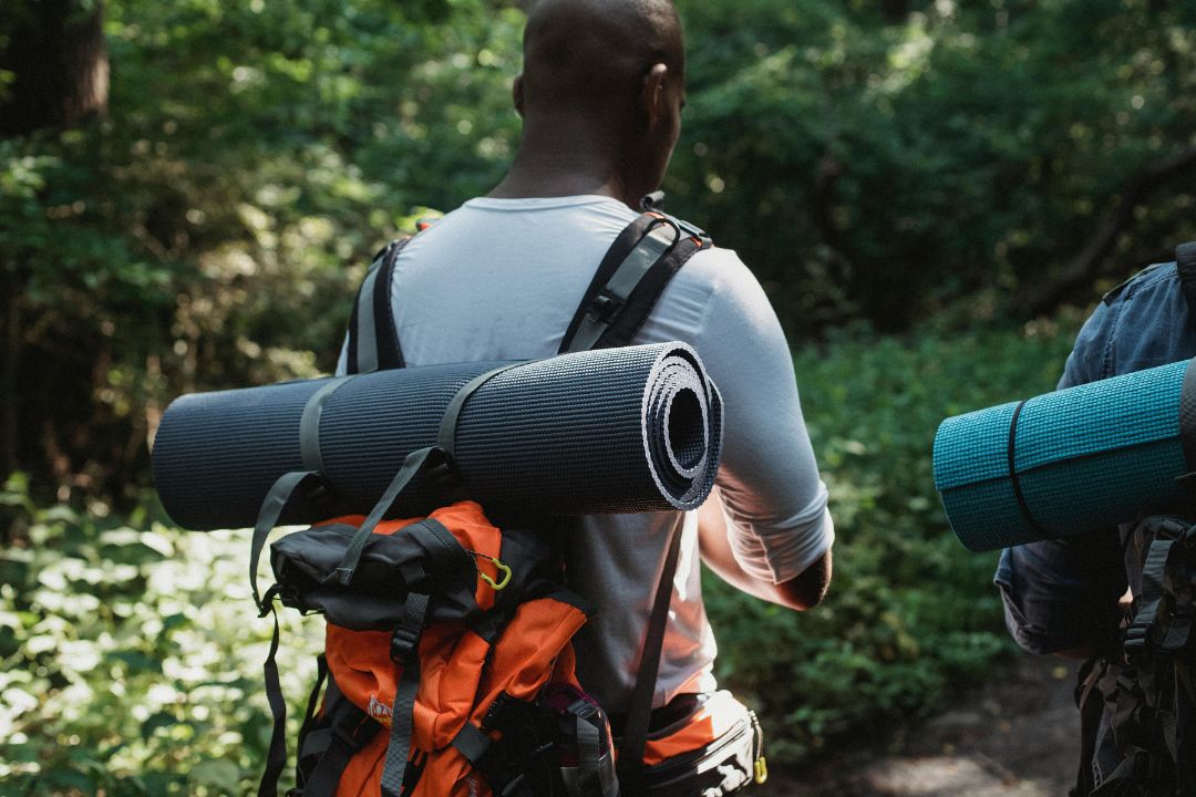 Hiker packing gear for a Kilimanjaro climb